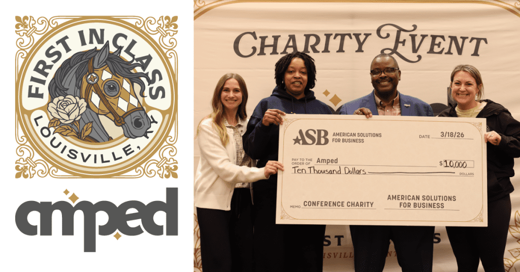 Four people smile while holding a large $10,000 ASB check for Amped at a charity event. Logos for 